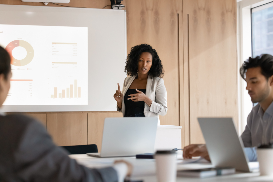 Black executive woman presenting confidently—executive presence, credibility, and leadership style