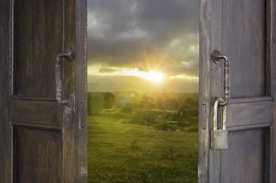 A weathered wooden door with a rusty padlock hangs open, revealing a bright sunrise over a green field—symbolizing breakthrough, spiritual freedom, emotional healing, and stepping into new life through forgiveness. A weathered wooden door with a rusty padlock hangs open, revealing a bright sunrise over a green field—symbolizing breakthrough, spiritual freedom, emotional healing, and stepping into new life through forgiveness.