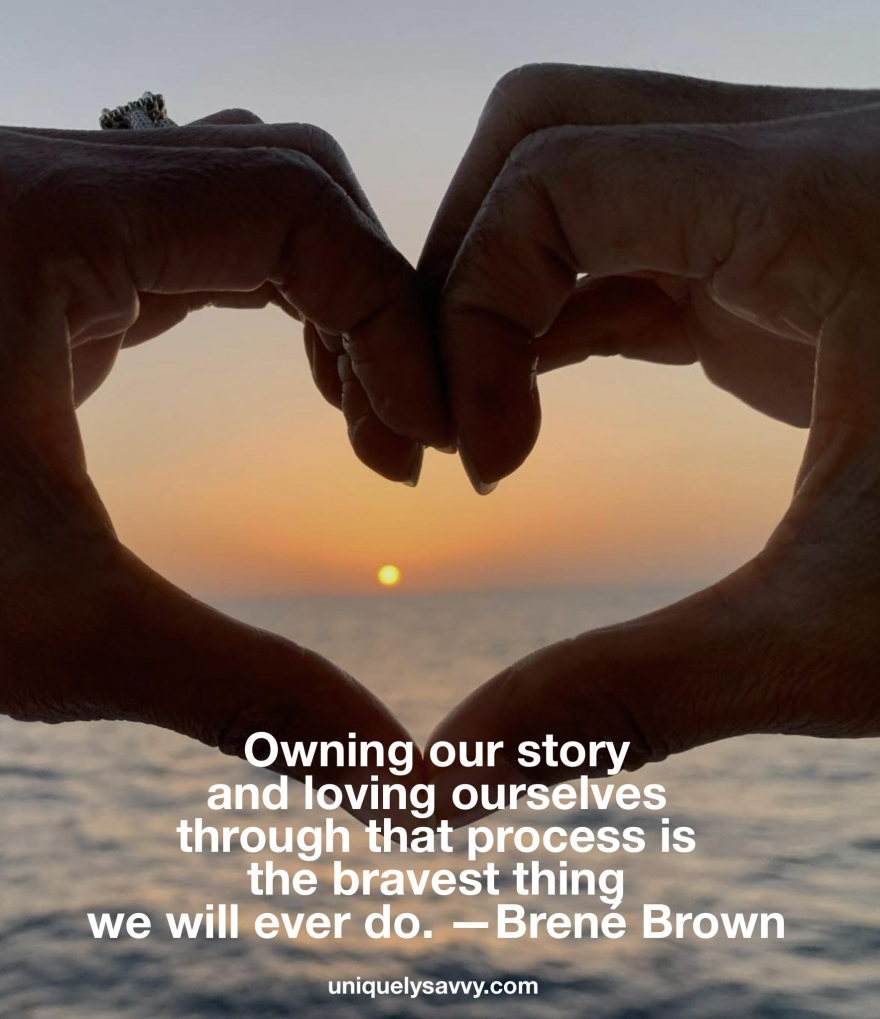 Hands forming a heart over ocean sunset — courage, self-love, wholeness. Hands forming a heart at sunset.