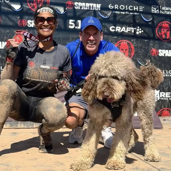 Kim Peterson with husband Kelly and Einstein the Wonderdog—Uniquely Savvy’s Ambassador of Healing and H.O.P.E.—symbolizing wholeness, partnership, and purpose.
