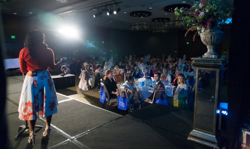 Kim Peterson delivering an authentic leadership keynote to a packed audience, inspiring resilience, empowerment, and self-leadership.