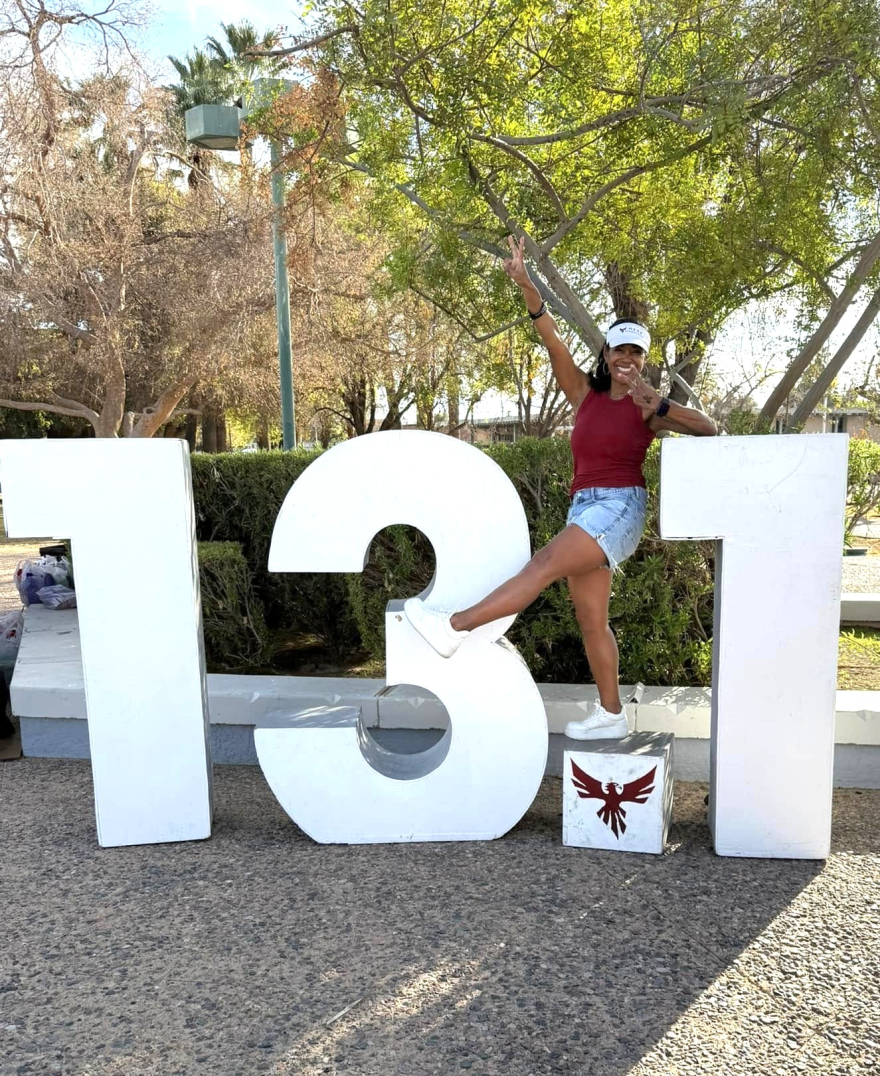 Kim Peterson after a half marathon—building resilience and WHOLE YOU health through endurance.