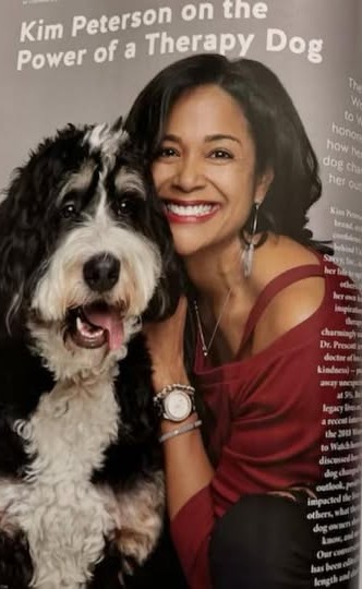 Kim Peterson featured with therapy dog—The Doctor of Love & Kindness.