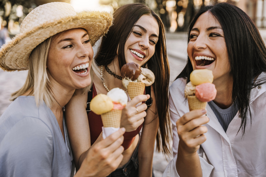 Women enjoying ice cream—joy and connection.