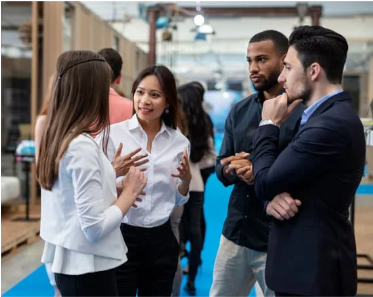 People standing in a small group, networking