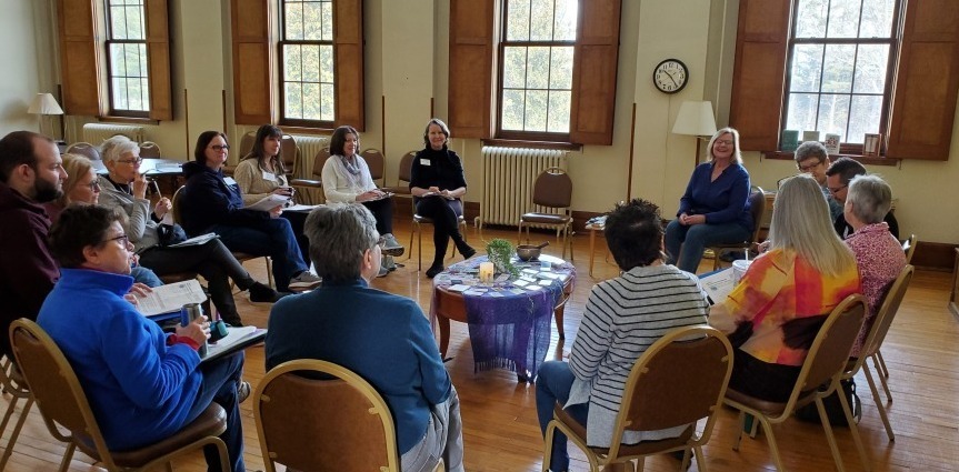 A group of people sitting in a circle