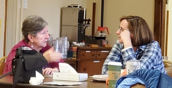 Two women listening to each other at a Transitions Retreat