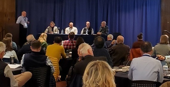 Conference with several people on stage